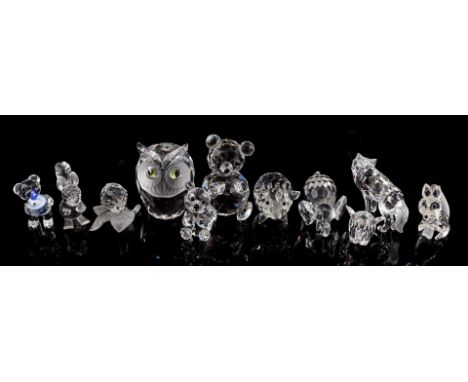 11 Swarovski crystal animal figures including snail on leaf, fox, pig, wolf, 3 various bears, owl, squirrel and 2 elephants, 