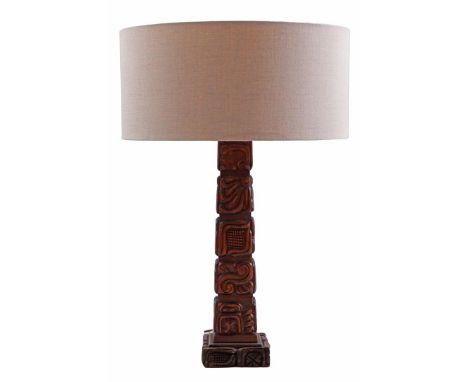 Teak wood table lamp inspired by totem poles of the Mayans, with cream-colored upholstered shade, executed by Temde Leuchten,