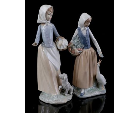 2 porcelain Nao statues of a woman with a dog and a woman with a goose, highest 26 cm high (chip tail goose)