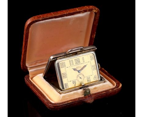 G. Nicole Lausanne travel alarm clock in an enamelled Sterling case, numbered 505732. 4.5 x 3.5 cm with an original leather b