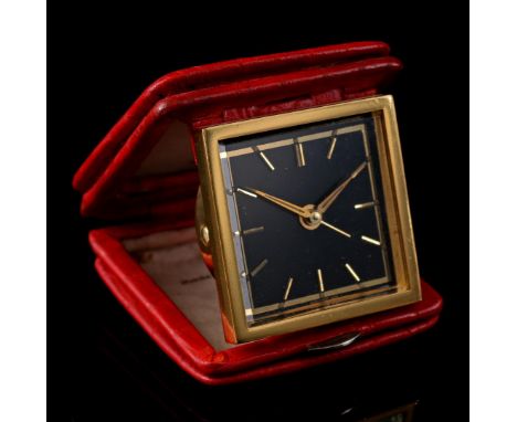 Swiss travel alarm clock, 1960s, in a red leather case, 6.5x7 cm