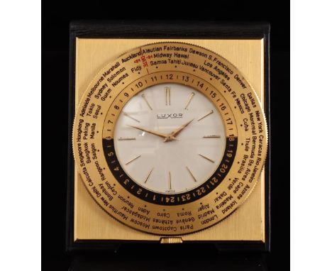 Luxor Swiss travel alarm clock in a brass case and leather case, case size is 56 mm