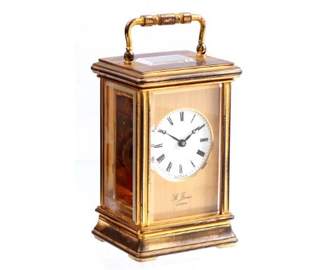 English travel alarm clock in brass case, marked St. James London, 13 cm high