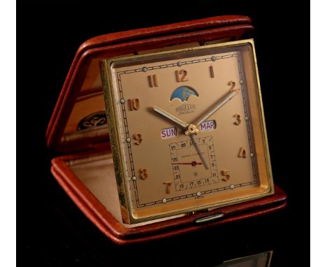 Angelus Folioluxe Swiss travel alarm clock with date, day and moon indication in a leather case, 9.5x9.5 cm with warranty cer
