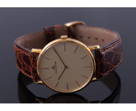 Jaeger LeCoultre men's wristwatch in a gold case, hand wound, case size is 33 mm on a leather strap