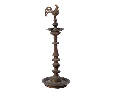 Standing oriental bronze oil lamp with rooster on top, 91 cm high