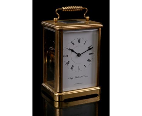 Copper travel alarm clock, movement marked on the dial Aug. Schatz and Sons, 16 cm high
