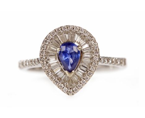 SAPPHIRE AND DIAMOND CLUSTER RINGset with a central pear shaped sapphire 5.4mm long and surrounded by taper cut diamonds and 