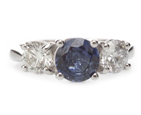 EIGHTEEN CARAT WHITE GOLD SAPPHIRE AND DIAMOND THREE STONE RINGset with a round sapphire of approximately 1.48 carats flanked