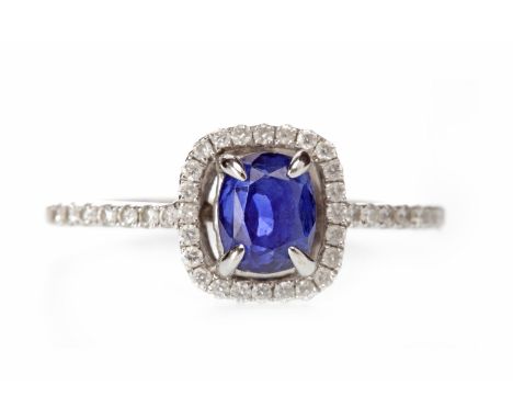 EIGHTEEN CARAT WHITE GOLD SAPPHIRE AND DIAMOND RINGset with a cushion cut sapphire of approximately 1.53 carats, surrounded b