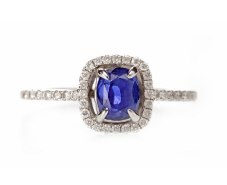 EIGHTEEN CARAT WHITE GOLD SAPPHIRE AND DIAMOND RINGset with a cushion cut sapphire of approximately 1.53 carats, surrounded b