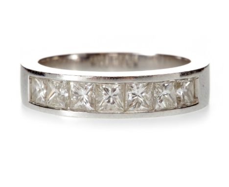 DIAMOND HALF ETERNITY RINGwith seven channel set princess cut diamonds totalling approximately 0.70 carats, marked 750, size 