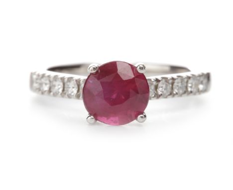 EIGHTEEN CARAT WHITE GOLD RUBY AND DIAMOND DRESS RINGset with a single round ruby of approximately 1.48 carats, on diamond sh