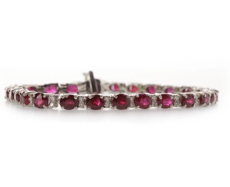 FOURTEEN CARAT WHITE GOLD RUBY BRACELETset with oval rubies each approximately 5mm long and totalling approximately 11.00 car