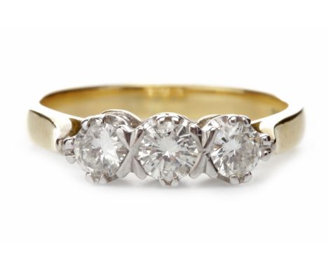 EIGHTEEN CARAT GOLD DIAMOND THREE STONE RINGset with round brilliant cut diamonds totalling approximately 0.60 carats, size K