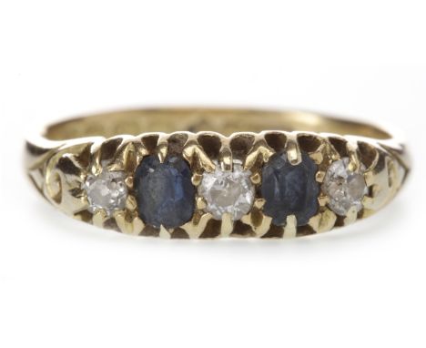 EARLY TWENTIETH CENTURY EIGHTEEN CARAT GOLD BLUE GEM AND DIAMOND RINGthe boat shaped bezel set with three old round brilliant