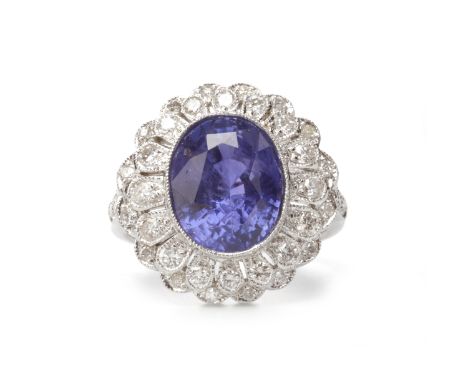 CERTIFICATED NATURAL COLOUR CHANGE SAPPHIRE AND DIAMOND CLUSTER RINGset with an oval colour change sapphire 11.6mm long, with