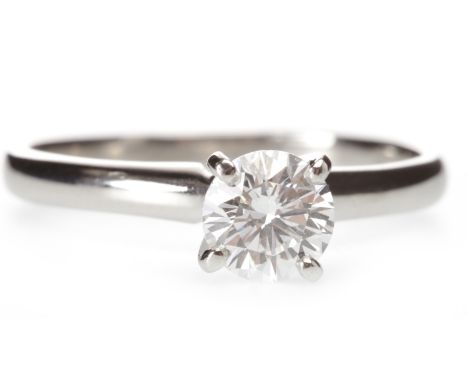 PLATINUM DIAMOND SOLITAIRE RINGwith a high set four claw mounted round brilliant cut diamond of approximately 0.60 carats, si