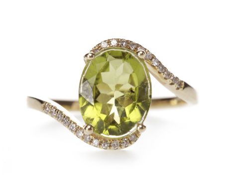 PERIDOT AND DIAMOND RINGset with an oval green peridot 9.9x7.9mm, on diamond set twist shoulders, the round brilliant cut dia