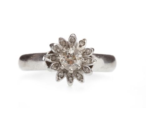 PLATINUM DIAMOND CLUSTER RINGwith a central eight claw set round brilliant cut diamond of approximately 0.35 carats, surround