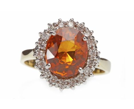 EIGHTEEN CARAT GOLD ORANGE SAPPHIRE AND DIAMOND RINGset with a central oval orange sapphire of approximately 3.90 carats with
