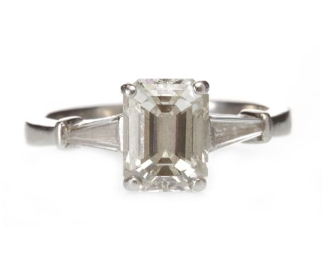 PLATINUM DIAMOND SOLITAIRE RINGset with an emerald cut diamond of approximately 2.04 carats, on taper cut diamond shoulders, 