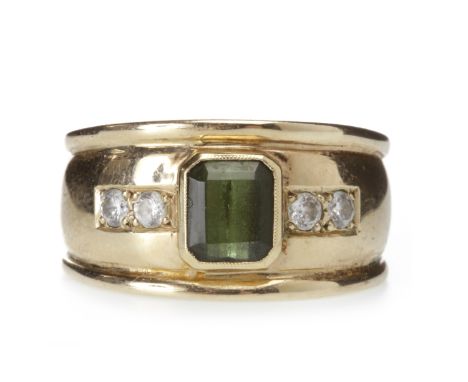 GEM SET DRESS RINGin the form of a tapered band set with a central emerald cut tourmaline, flanked by two pairs of round whit