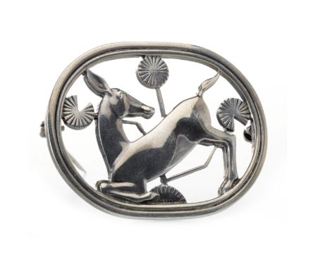 GEORG JENSEN STERLING SILVER DEER BROOCHdesigned by Arno Malinowski, of oval form, depicting a kneeling deer surrounded by st