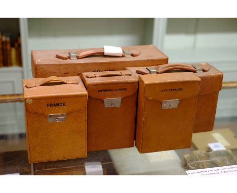 *France. Three map cases containing folding road maps, pub. Edward Stanford, n.d., c.1910, including small leather case with 