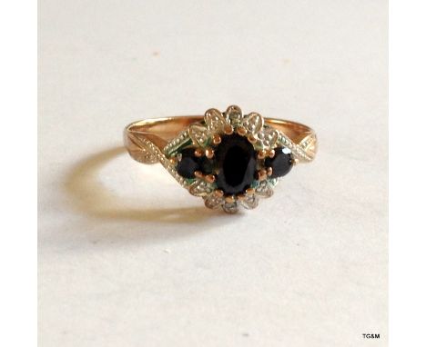 A 9ct sapphire cluster ring, size Q