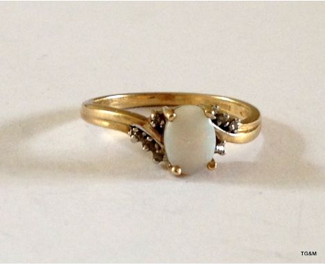 A 9ct gold opal and diamond ring hallmarked Size M