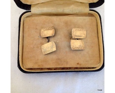 A silver and gilt pair of gents cufflinks