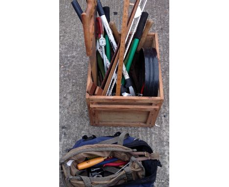 A box of mixed hand tools to inc, saws, loppers and a tool bag with various spanners and other tools. 