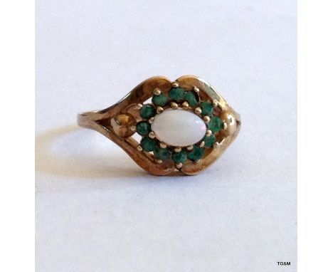 A 9ct gold Emerald and Opal ring size P