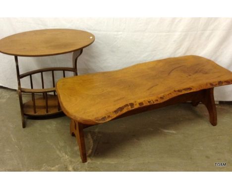 A Rustic Light Oak Coffee Table and Oval Small Oak Table Over a Magazine Rack.