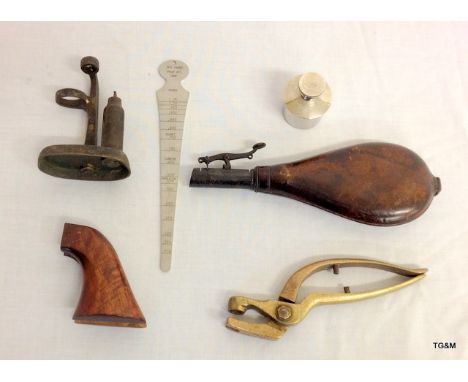 A small collection of shooting accessories including a brass & leather powder flask - two brass reloading tools - a pair of w