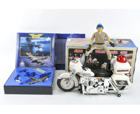 A Corgi Aviation Archive 'Lancaster Bomber' and a vintage Jumbo Cycle Police bike, in the original boxes