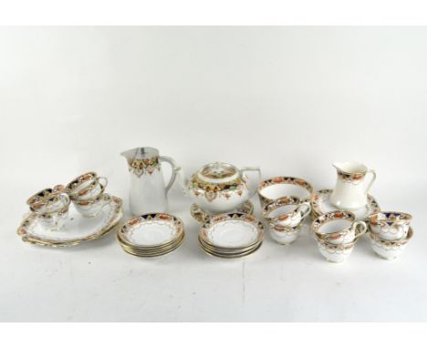 A selection of Imari pattern ceramic tableware consisting of cups, saucers, side plates and dinner plates from various makers