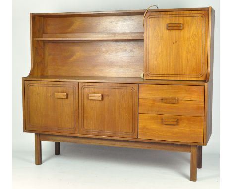 An Alfred Cox teak sideboard, circa 1960, with one shelf and cupboard above three graduated drawers and two cupboard doors, o