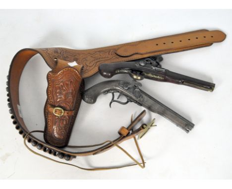 Two reproduction flintlock style guns, one being a 'Forsyth patent' together with a leather pistol and ammunition holster bel