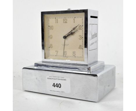 A  Art Deco style chrome alarm clock with Swiss advertising to two sides, for Winterhur LEBEN-VIE,  the dial with Arabic nume