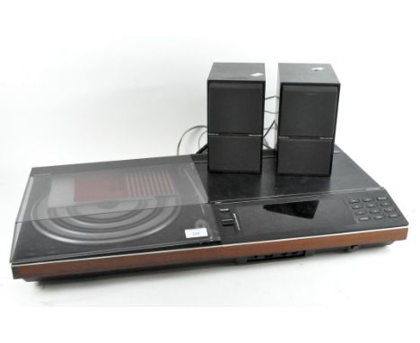 A Bang &amp; Olufsen Beocenter 5000 record player, together with a pair of Beovox C40 6OHM Bang &amp; Olufsen speakers