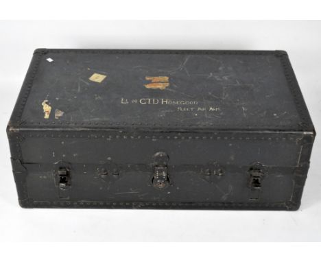 An early 20th century wardrobe/travelling trunk, with rivetted decoration, 102cm high