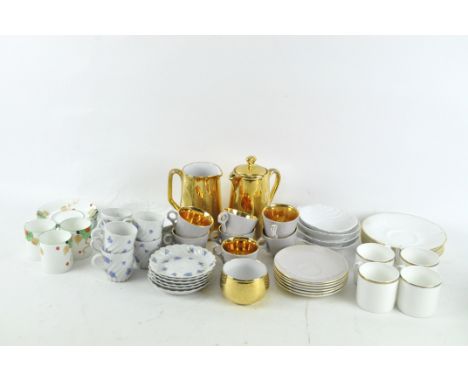 A Royal Worcester part coffee service, together with a set of Limoges cups and saucers with blue floral decoration, shell dis