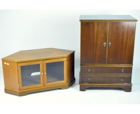 A modern television cabinet and stand in mahogany with folding hinged doors above two faux drawers, 97cm x 69cm x 45cm, toget