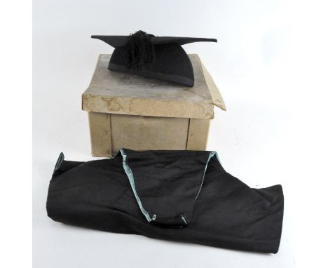 A vintage cardboard Eve &amp; Ravenscroft hat box with black mortarboard and graduation hood