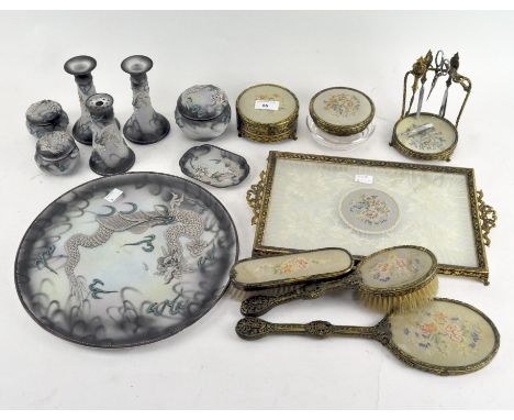 A vintage vanity dressing table set to include tray, mirrors, brushes and trinket boxes, all with embroidered floral designs,