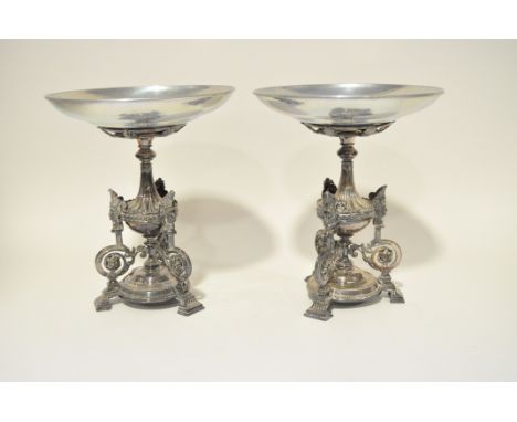 A pair of Victorian silver plated stands, in the classical design with tripod bases, height 27cm