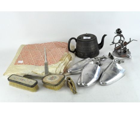 An Edwardian silver-plated teapot, together with four Harrods shoe horns, a brass nut cracker cast as a pair of legs, assorte