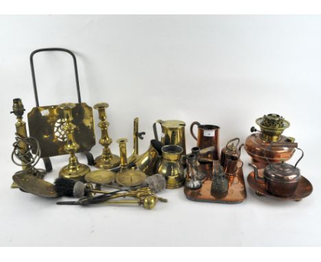 A selection of assorted metalware, most being brassware, including an oil lamp base, pair of candlesticks, pouring jugs and m